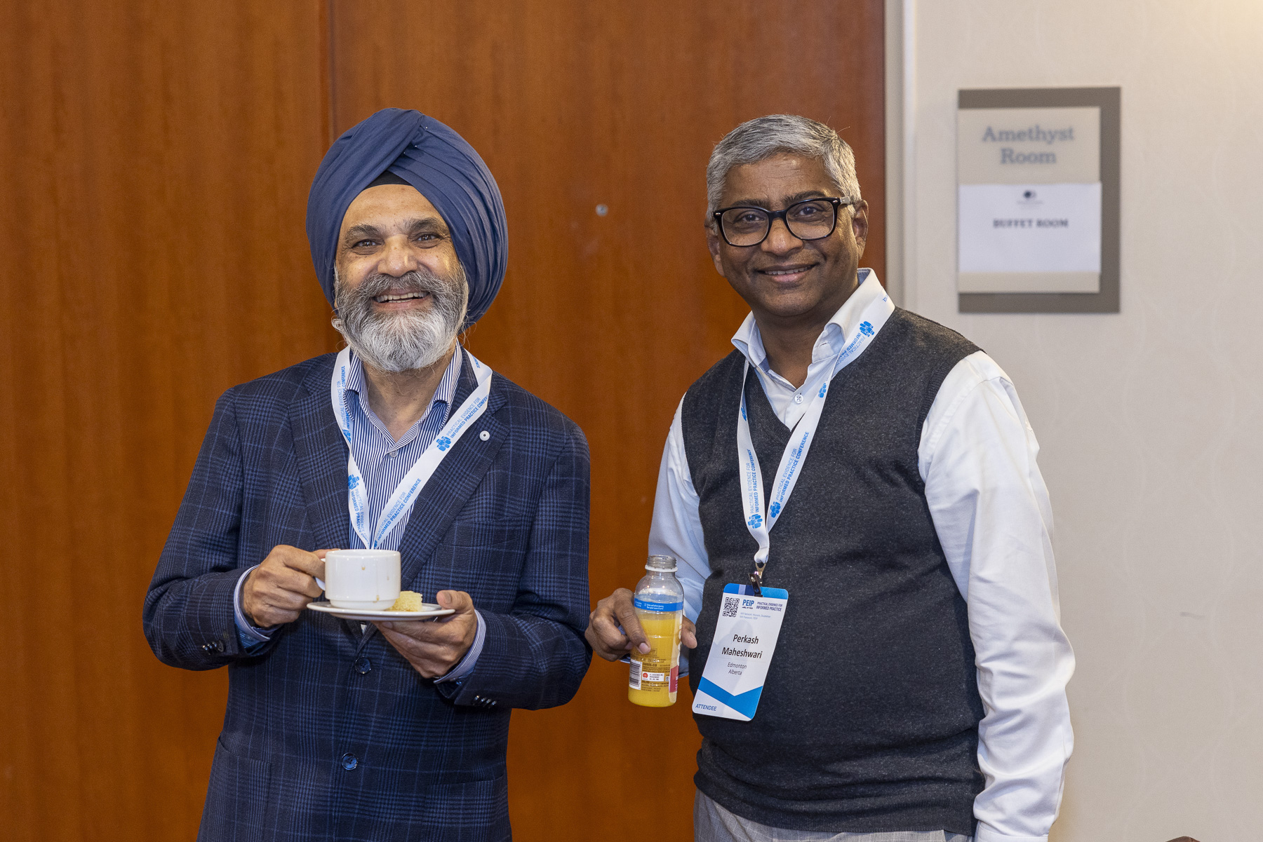 Two attendees at the coffee break