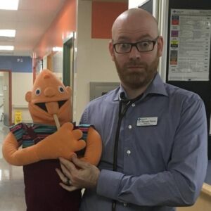Michael Pierse holding a puppet
